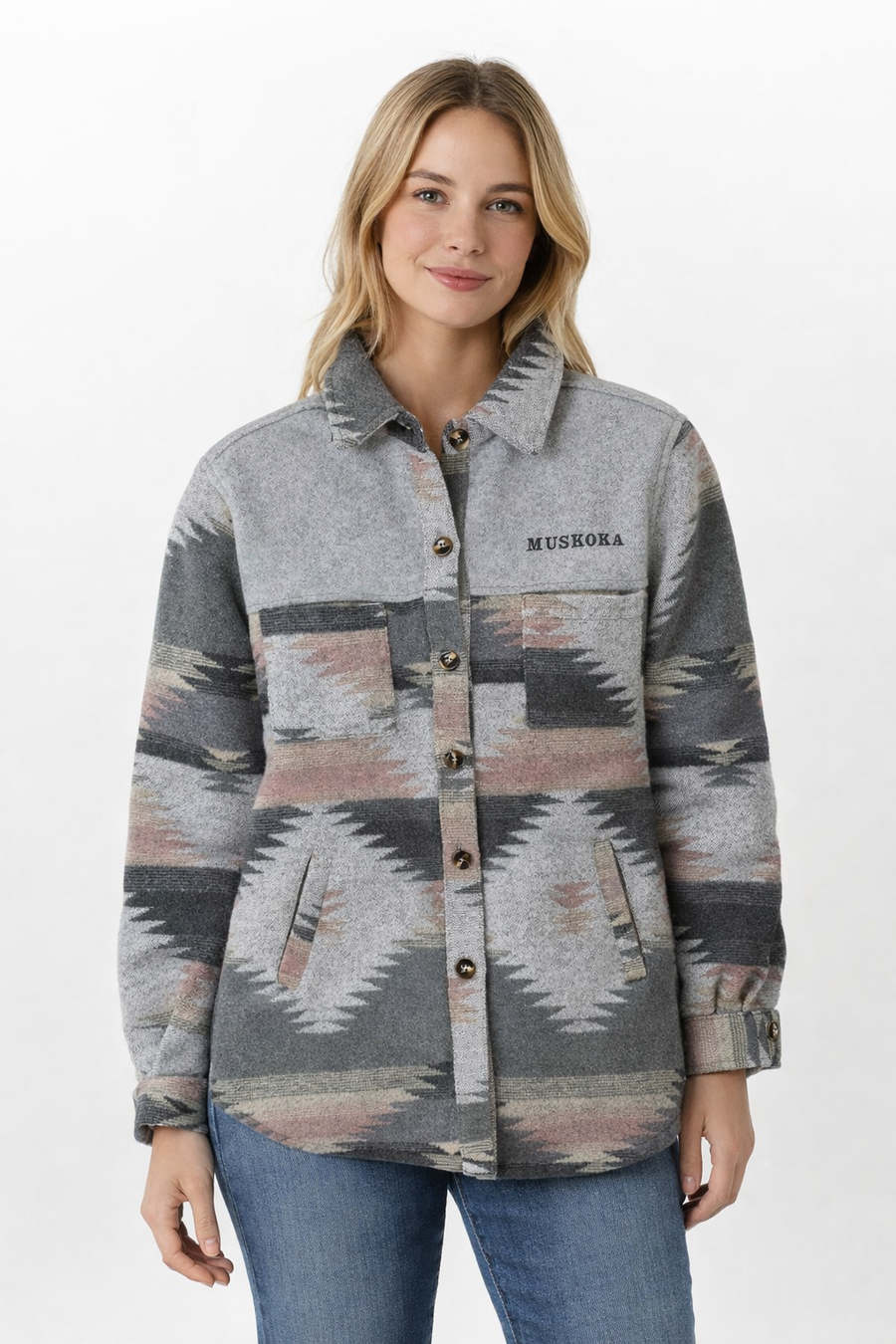 Woman wearing a patterned shirt jacket with 'Muskoka' branding on a white background
