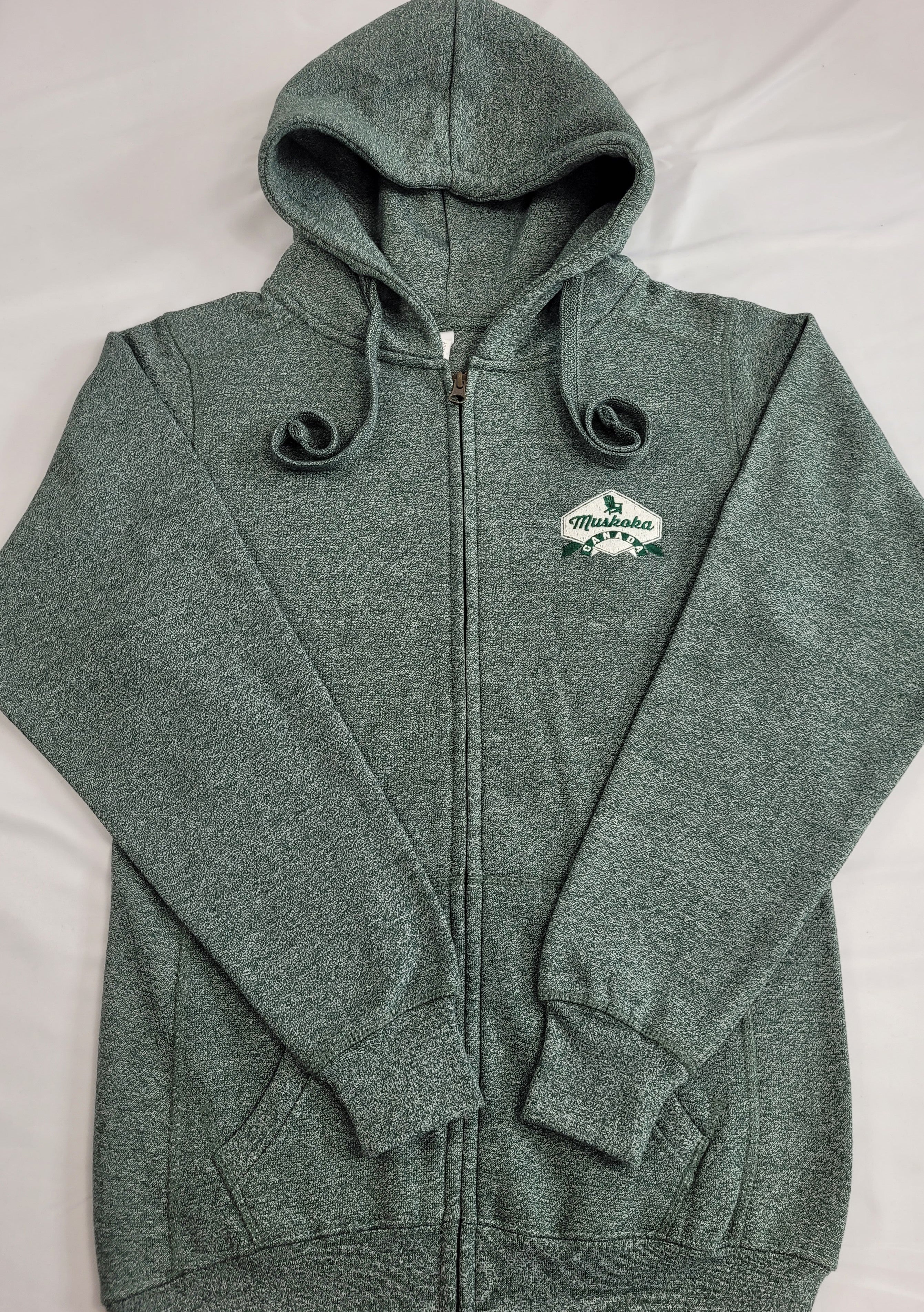 Green full-zip hoodie with a hood, featuring a white embroidered crest on the chest, long sleeves, and banded cuffs.