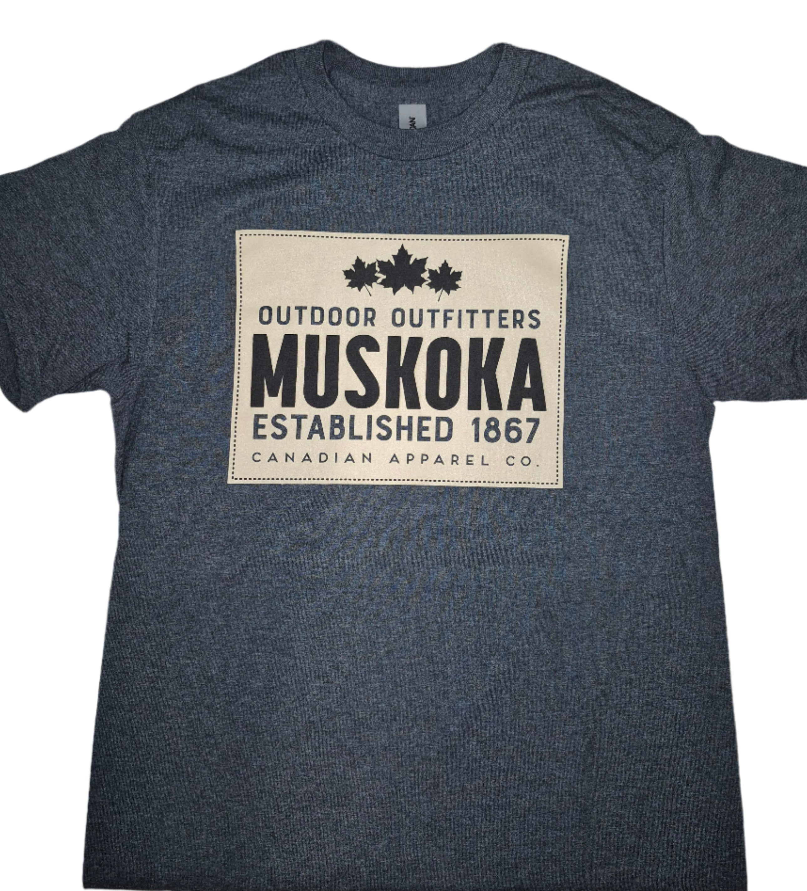Blue t-shirt with Muskoka branding on a beige background