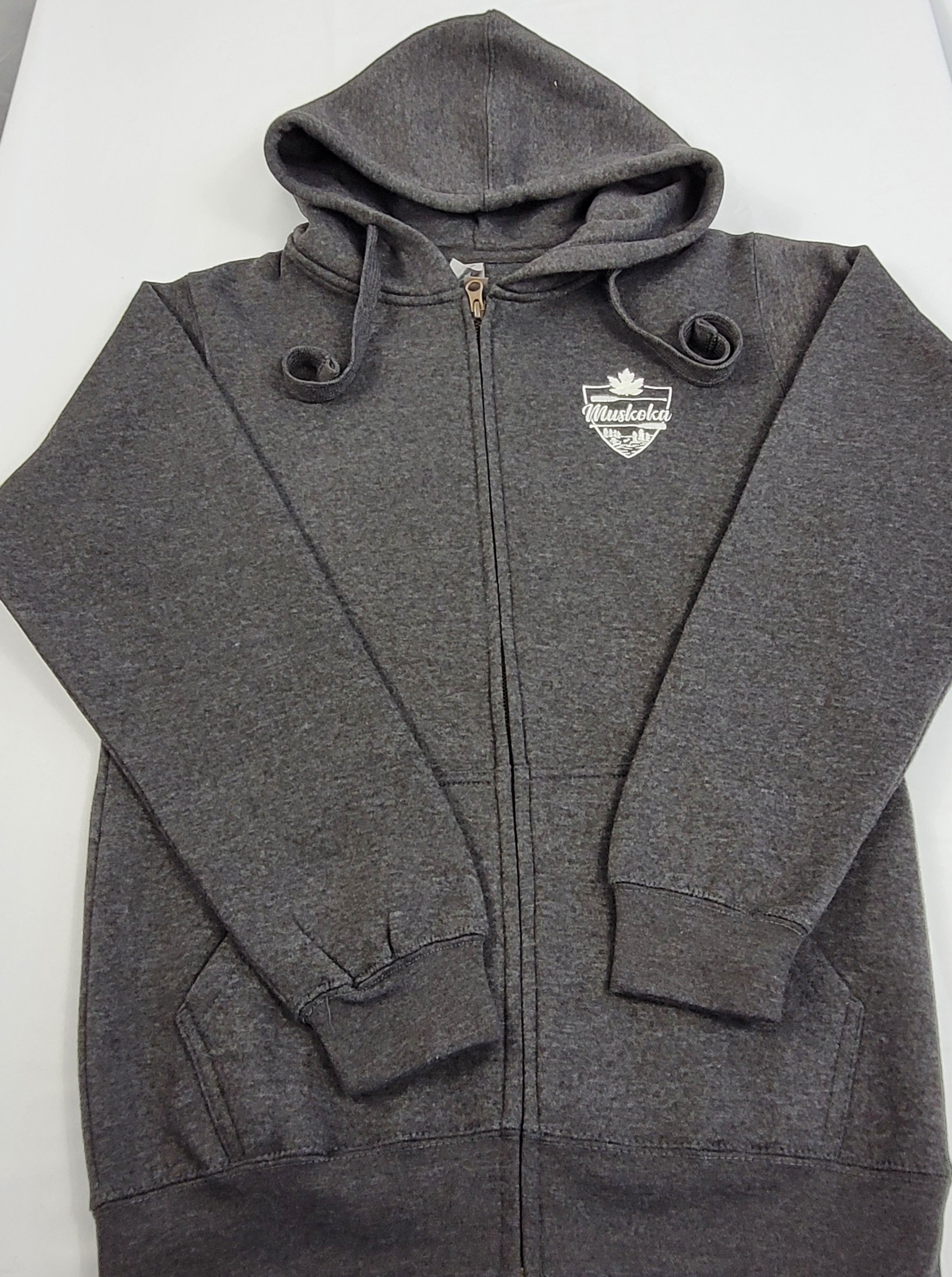 Charcoal grey full zip hoodie with relaxed hood and long sleeves, featuring a white embroidered crest on the front.