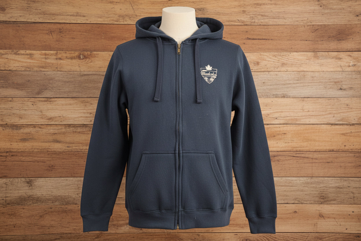 Navy blue full zip heavy hoodie with relaxed hood and long sleeves, featuring a white embroidered Muskoka crest on the front.