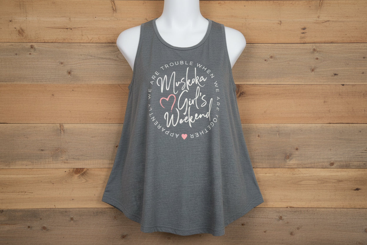 A gray tank top with text and heart graphics, designed for women's weekend events.