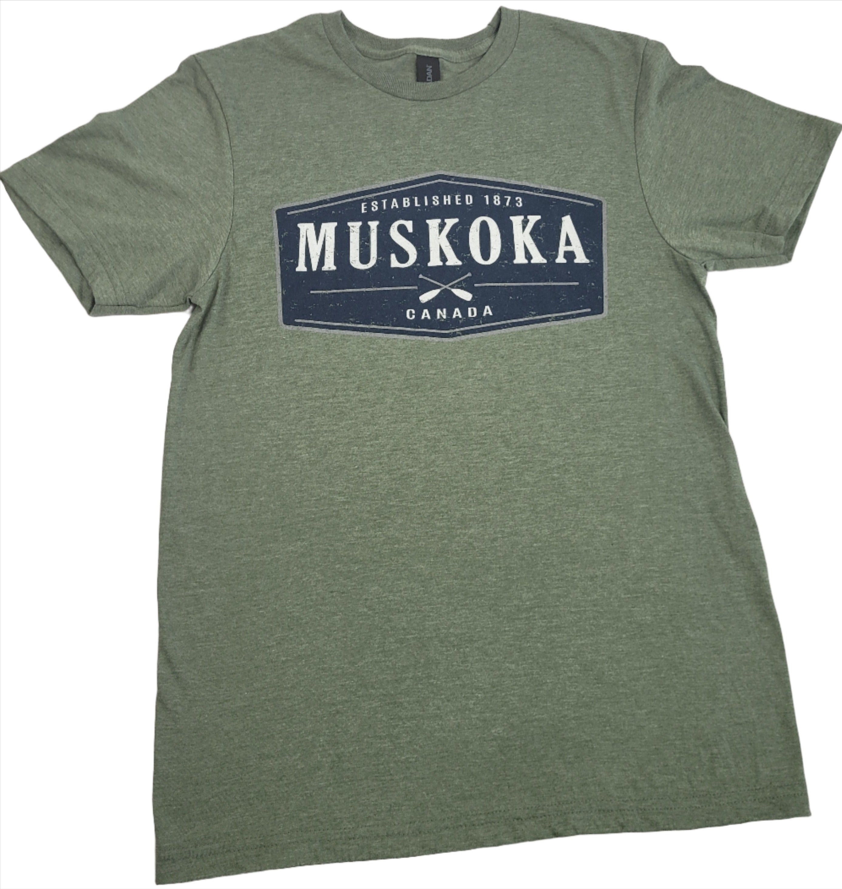 Green short-sleeved T-shirt with 'MUSKOKA CANADA' printed on the front.